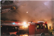 Fire Apparatus in Front of a Burning Building